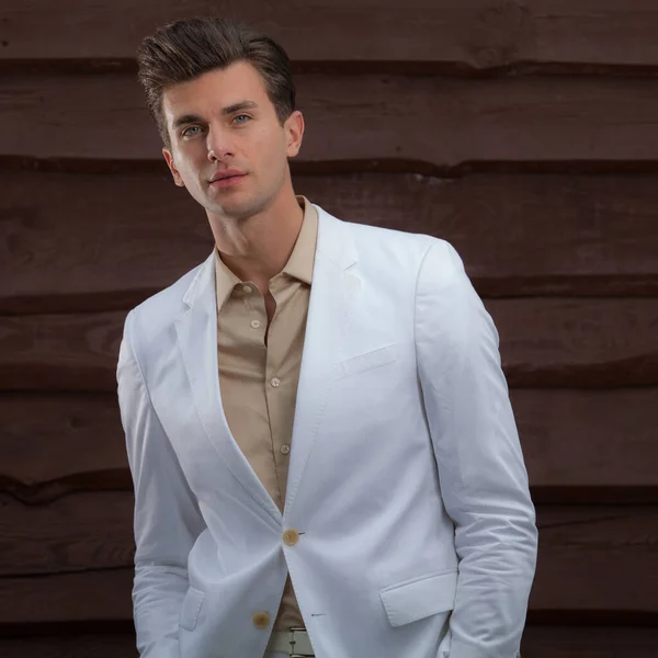 Portrait of handsome young man on wooden background. — Stock Photo, Image