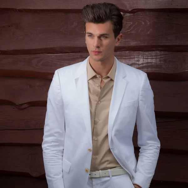 Portrait of handsome young man on wooden background. — Stock Photo, Image