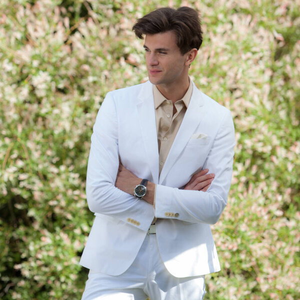 Young elegant handsome man posing outside.