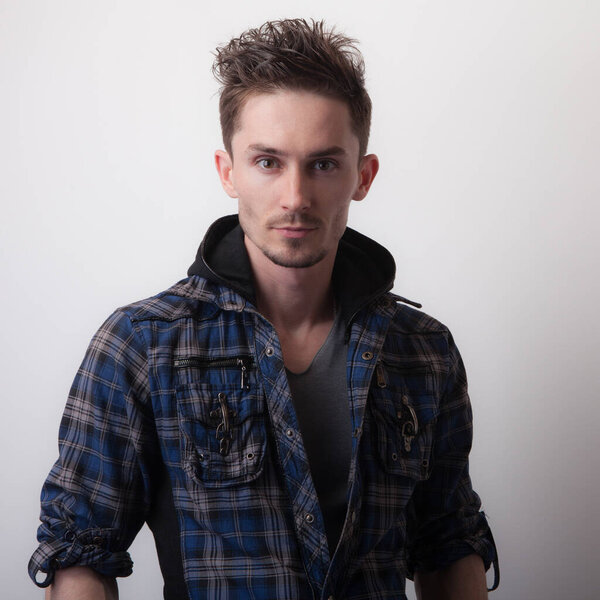 Handsome young elegant man studio portrait.