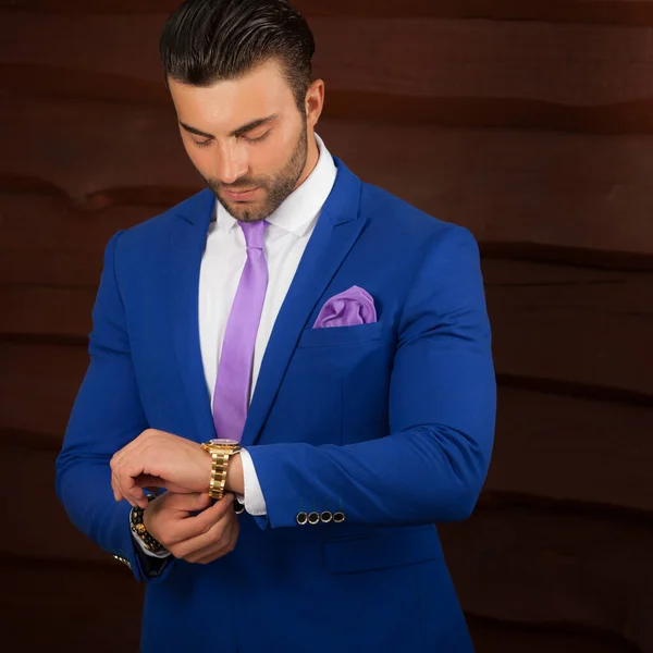 Portrait of handsome young man on wooden background. — 스톡 사진