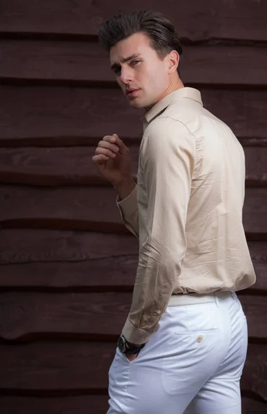 Portrait of handsome young man on wooden background. — Stock Photo, Image