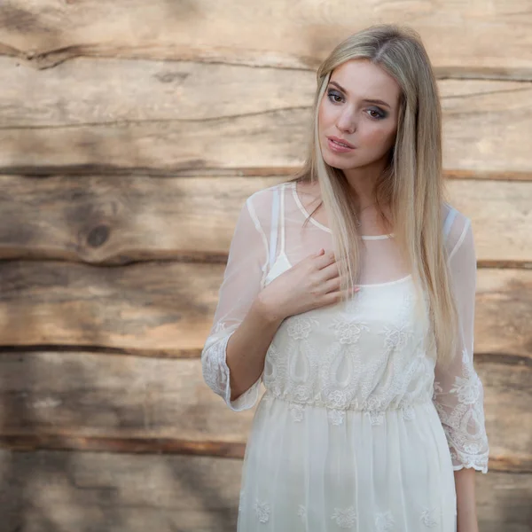 Portrait of beautiful young girl on wooden background. — Stock Photo, Image