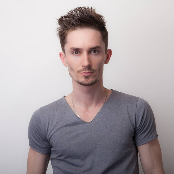 Handsome young elegant man studio portrait.