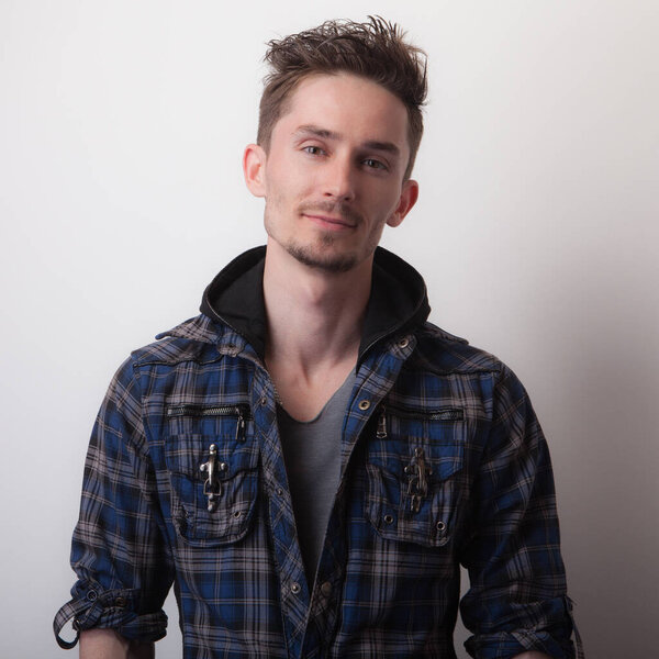 Handsome young elegant man studio portrait.