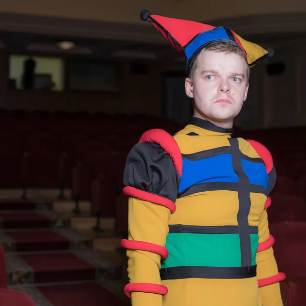 Actor dressed jesters costume in interior of old theater. — Stock Photo, Image