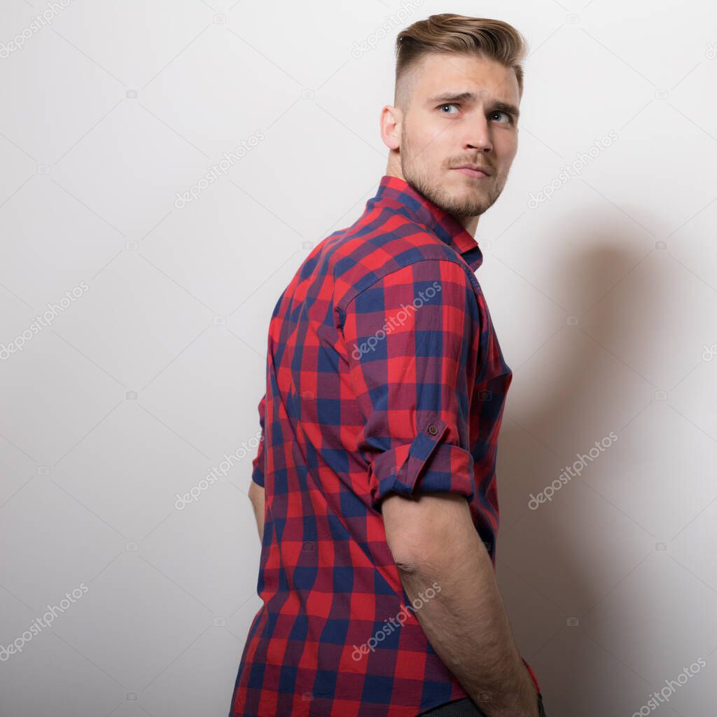 Handsome young elegant man studio portrait.