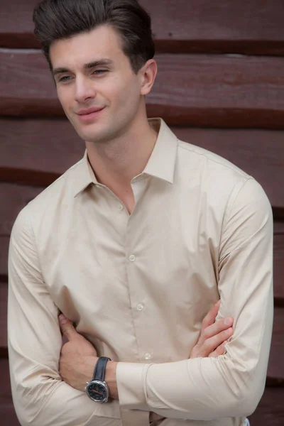 Portrait of handsome young man on wooden background. — Stock Photo, Image