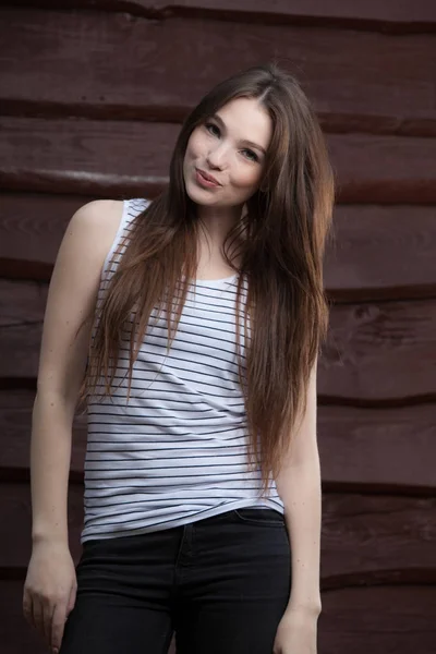 Portrait of beautiful young girl on wooden background. — 스톡 사진