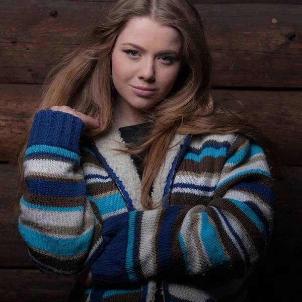 Portrait of beautiful young girl on wooden background. — Stock Photo, Image