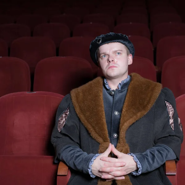 Actor dressed historical costume in interior of old theater. — Stock Photo, Image
