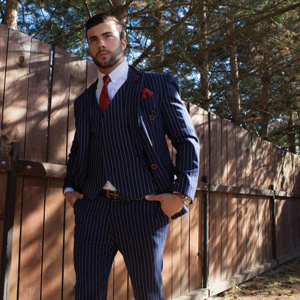 Young elegant handsome man posing outside. — Stock Photo, Image