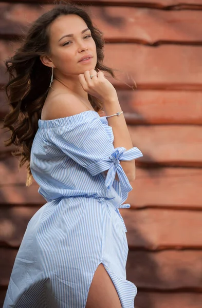 Portrait of beautiful young girl on wooden background. — Stock Photo, Image