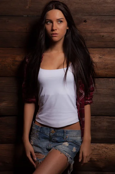 Portrait of beautiful young girl on wooden background. — 스톡 사진