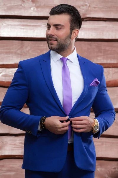 Portrait of handsome young man on wooden background. — Stock Photo, Image