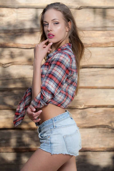 Portrait of beautiful young girl on wooden background. — Stock Photo, Image