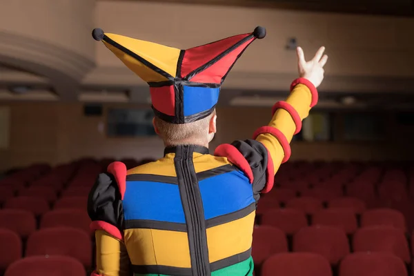Actor dressed jesters costume in interior of old theater. — Stock Photo, Image