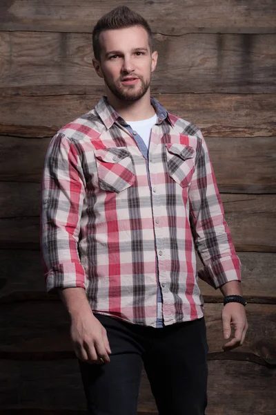 Portrait of handsome young man on wooden background. — Stock Photo, Image