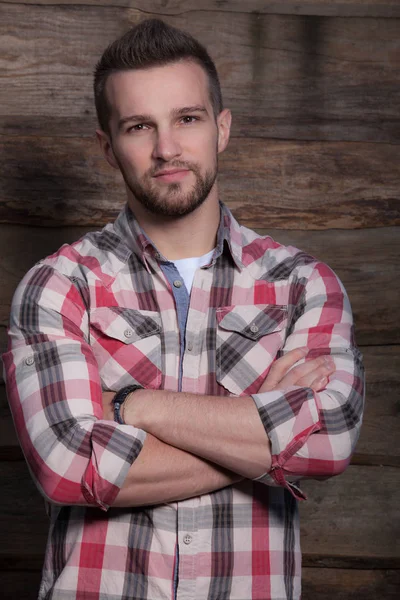 Portrait of handsome young man on wooden background. — 스톡 사진