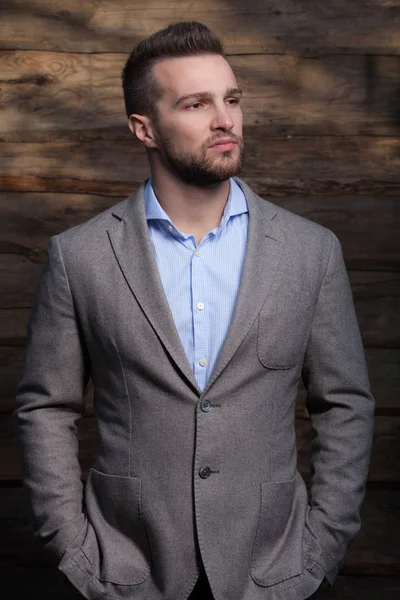 Portrait of handsome young man on wooden background. — Stock Photo, Image