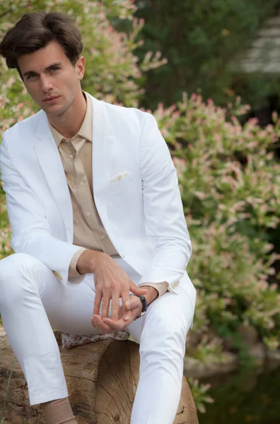 Portrait of young elegant handsome man posing outside. — Stock Photo, Image