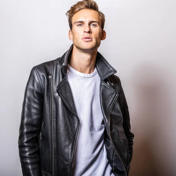 Handsome young man in classic leather jacket.