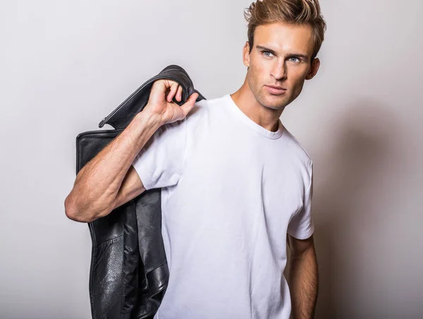 Handsome young man in classic leather jacket. — Stock Photo, Image