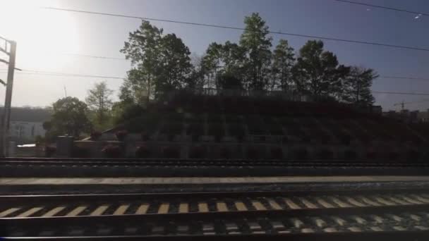 Vista através da janela em províncias da China em trem de alta velocidade. Filmagem em câmera lenta . — Vídeo de Stock