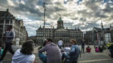 AMSTERDAM, NETHERLANDS - MAY 25, 2017: Famous attractions and canals of Amsterdam city. General view of the cityscape and traditional Netherlands architecture. 4K Time Lapse 2 in 1.