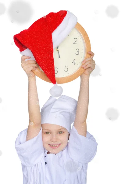 Girl with clock, Santa red hat and snow — Stock Photo, Image