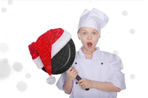 Surprised girl, frying pan and Santa hat with snow — Stock Photo, Image