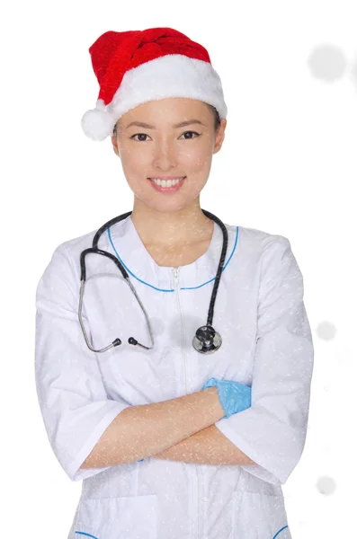 Asijské doktor a čepice Santa s sníh — Stock fotografie