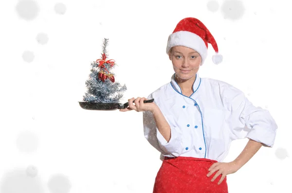 Cook with Christmas tree in pan covered and snow — Stock Photo, Image