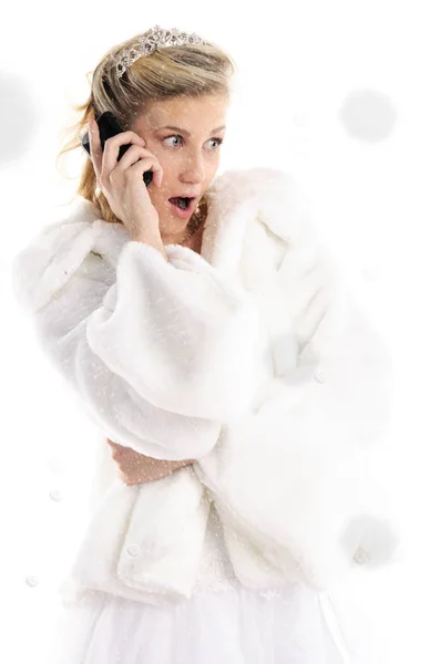 Surprised bride with mobile phone and snow — Stock Photo, Image