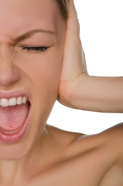 Emotional beautiful woman covers her ear with her palm — Stock Photo, Image