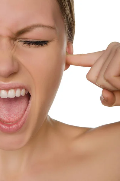 Emotional beautiful woman covers ear with her finger Stock Photo