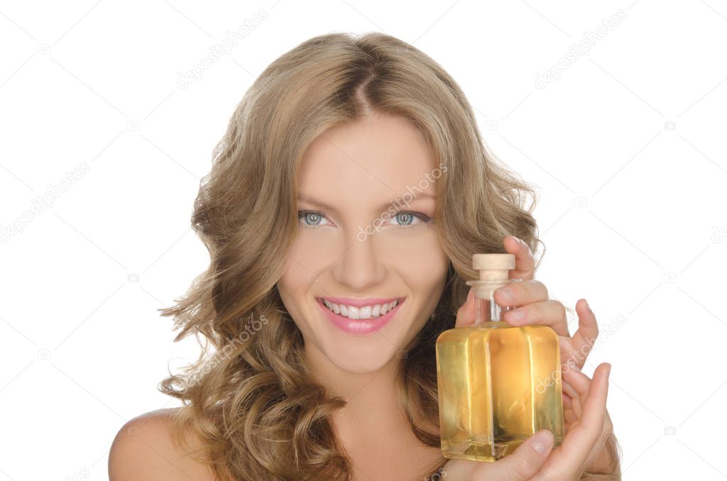 Beautiful woman with moisturizing skin oil