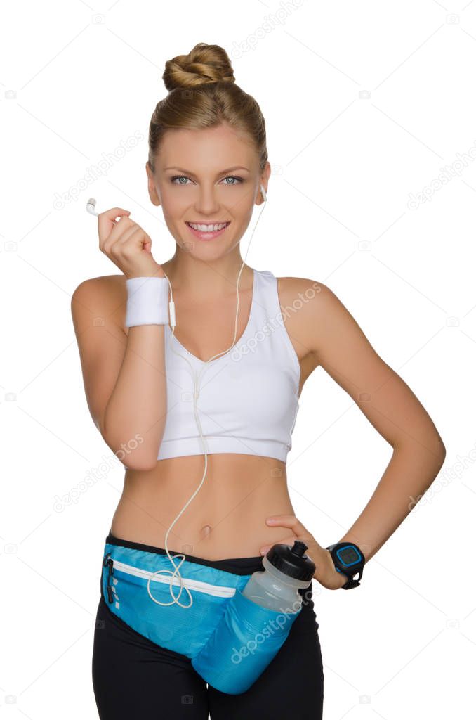 European woman in clothes and with accessories for playing sports