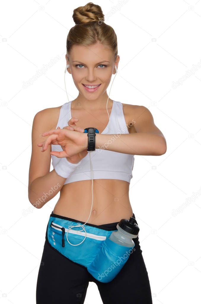 Sports woman controls herself during a workout