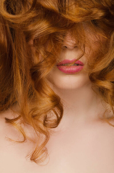 Beautiful red hair on the face of woman