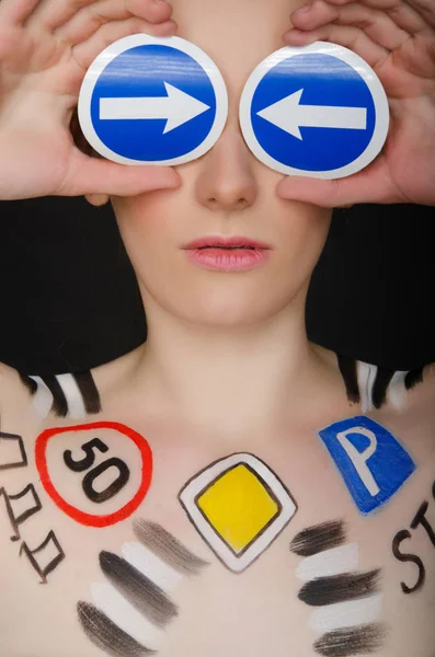 Portrait of woman with traffic signs — Stock Photo, Image