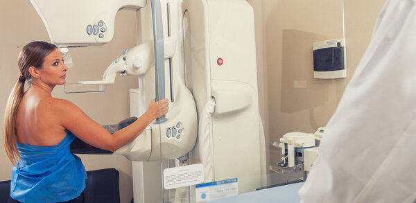 Woman in 40s about to undergoing a mammography test in hospital 