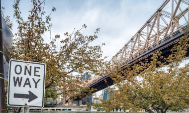 Queensboro Bridge in New York City with street sign clipart