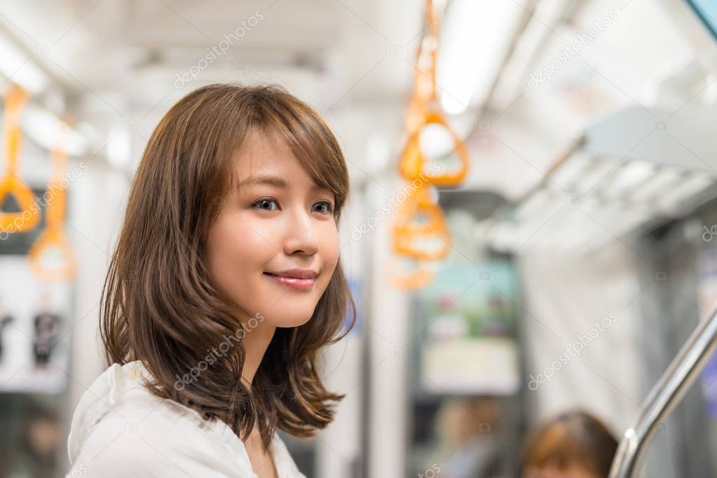 young woman inside subway train
