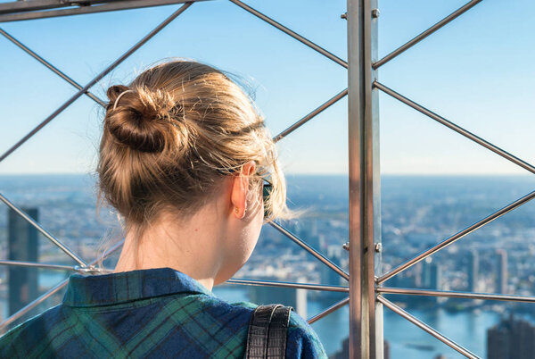 Blonde woman enjoying picturesque cityscape of New York Skyline