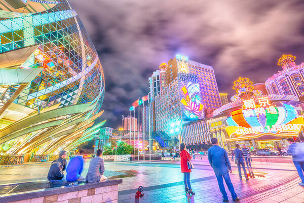 MACAU, CHINA - APRIL 2014: City skyline with casinos lights at n