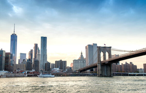 Downtown Manhattan and Brooklyn Bridge panorama at dusk, New York.
