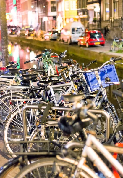 Bicycles lining a bridge over the canals of Amsterdam, Netherlan — Stock Photo, Image