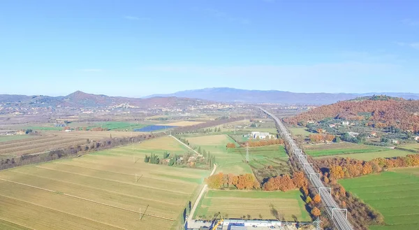 Aerial view of fast railway in open countryside