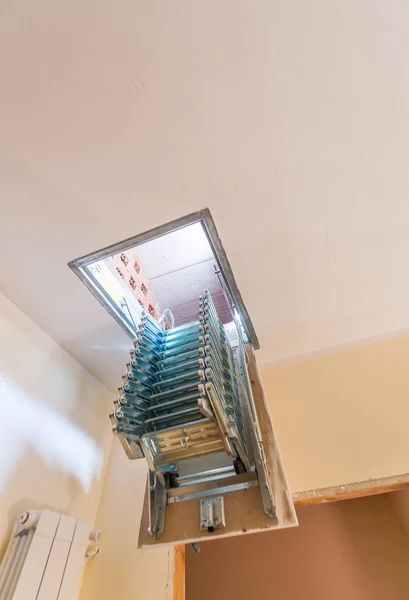 Folding staircase to attic room — Stock Photo, Image